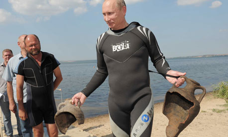 Vladimir Putin emerges form a dive at Phanagoria(the ancient Palace of Mithradates) in 2011 with 2 ancient urns.